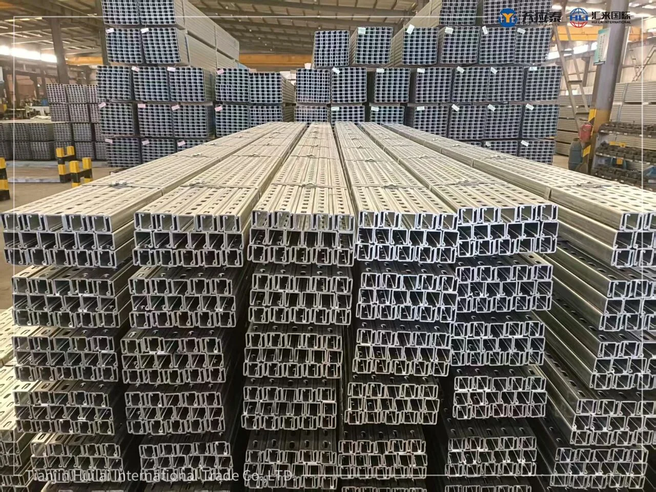 Slotted solar mounting steel channels stacked inside the factory